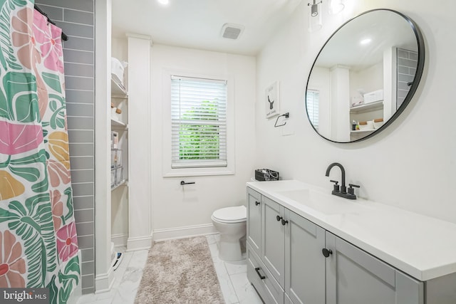 330 Date St, Warminster, PA 18974 - bathroom featuring vanity, baseboards, toilet, and marble look tiles