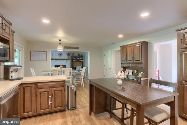 46 Gelsinger Rd, Reading, PA 19608 - kitchen featuring appliances with stainless steel finishes, light wood-style flooring, light countertops, a peninsula, and recessed lighting
