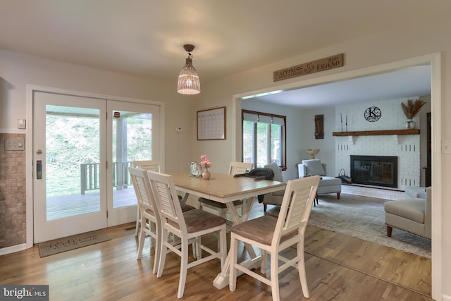 46 Gelsinger Rd, Reading, PA 19608 - dining space featuring light wood-style floors and a brick fireplace