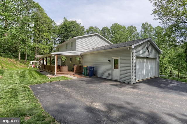 46 Gelsinger Rd, Reading, PA 19608 - view of home's exterior with driveway, a lawn, and view of wooded area