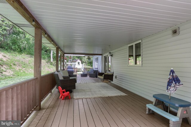 46 Gelsinger Rd, Reading, PA 19608 - wooden deck with an outdoor living space