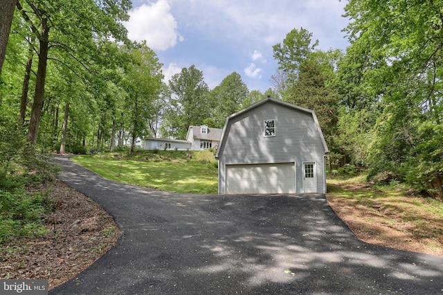 46 Gelsinger Rd, Reading, PA 19608 - garage featuring a garage and asphalt driveway