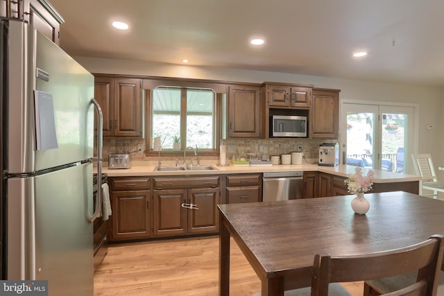 46 Gelsinger Rd, Reading, PA 19608 - kitchen with appliances with stainless steel finishes, a sink, light wood-type flooring, tasteful backsplash, and recessed lighting
