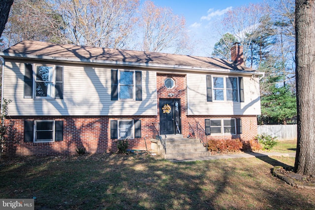 15 Hay Barn Rd, Stafford, VA 22556 - split foyer home featuring brick siding and a chimney