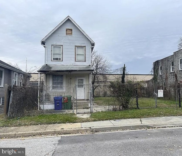 911 N Lehigh St, Baltimore, MD 21205 - view of front of property featuring a porch, a gate, and a fenced front yard