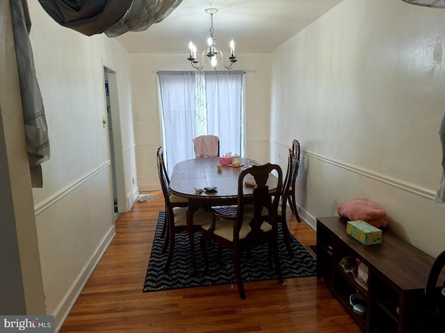 6505 Walker St, Philadelphia, PA 19135 - dining room featuring a chandelier, wood finished floors, and baseboards