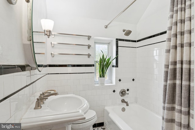 5721 Greenspring Ave, Baltimore, MD 21209 - full bath featuring shower / bath combo with shower curtain, tile walls, toilet, wainscoting, and a sink