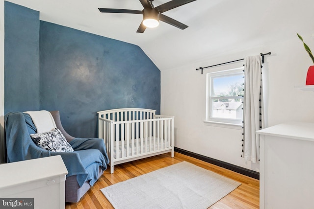 5721 Greenspring Ave, Baltimore, MD 21209 - bedroom with vaulted ceiling, wood finished floors, and a ceiling fan