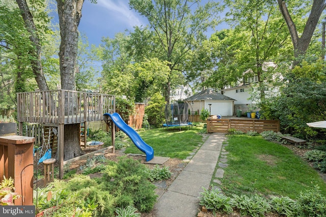 5721 Greenspring Ave, Baltimore, MD 21209 - view of yard featuring a playground, an outdoor structure, a trampoline, and a deck