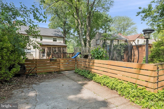 5721 Greenspring Ave, Baltimore, MD 21209 - view of patio with a sunroom and a playground