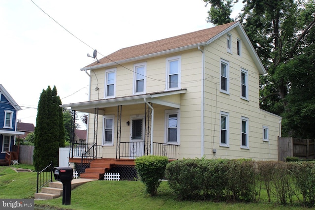 301 E 3rd St, Avondale, PA 19311 - view of front of home featuring covered porch and a front yard