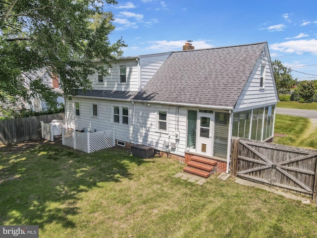 301 Hamilton Blvd, Warsaw, VA 22572 - back of house with entry steps, a chimney, a shingled roof, and central AC