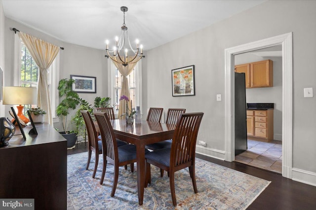 233 Rhode Island Ave NW, Washington, DC 20001 - dining room featuring a chandelier, baseboards, and dark wood-type flooring