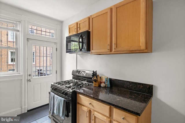 233 Rhode Island Ave NW, Washington, DC 20001 - kitchen with black appliances, dark stone counters, and tile patterned floors