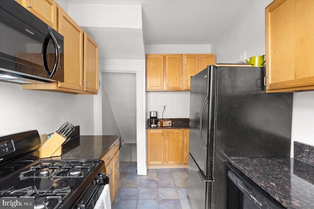 233 Rhode Island Ave NW, Washington, DC 20001 - kitchen with black appliances, light tile patterned flooring, and dark stone countertops