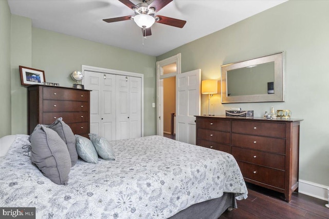 233 Rhode Island Ave NW, Washington, DC 20001 - bedroom with dark wood-style flooring, baseboards, a closet, and a ceiling fan