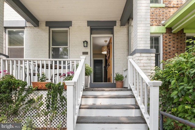 233 Rhode Island Ave NW, Washington, DC 20001 - property entrance featuring covered porch and brick siding