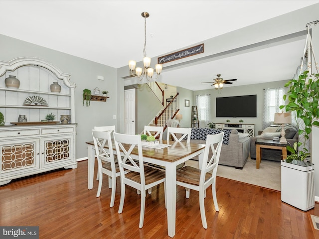 1419 Ramblewood Dr, Emmitsburg, MD 21727 - dining area featuring stairway, wood finished floors, a ceiling fan, and a chandelier