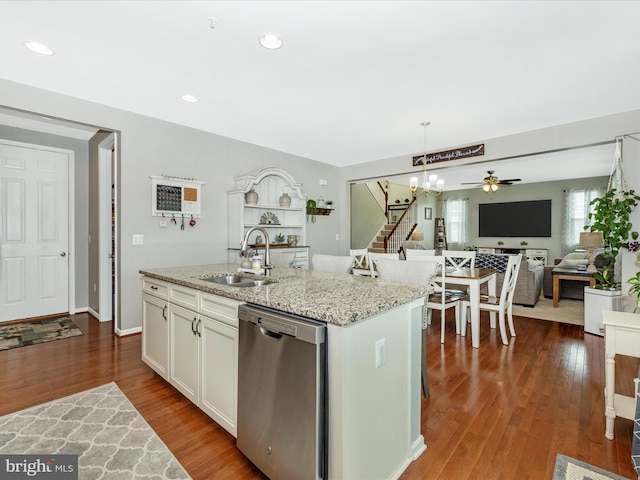 1419 Ramblewood Dr, Emmitsburg, MD 21727 - kitchen with stainless steel dishwasher, a sink, open floor plan, white cabinets, and decorative light fixtures