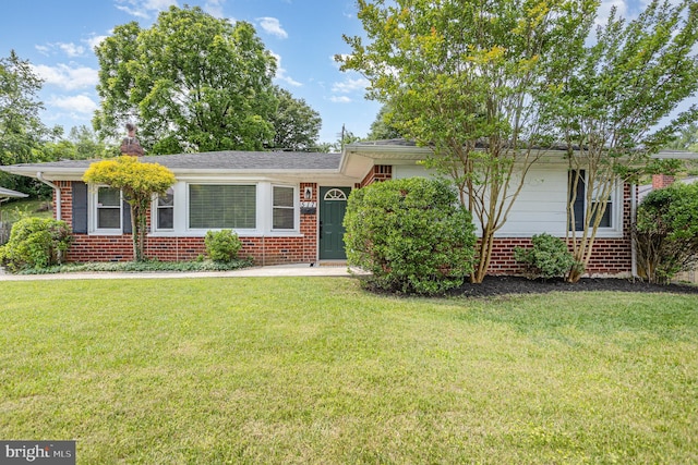 517 Goucher Blvd, Baltimore, MD 21286 - view of front of home with brick siding and a front lawn