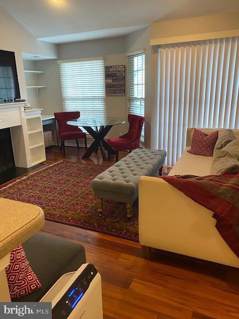 3916 Penderview Dr Unit 435, Fairfax, VA 22033 - living area with wood finished floors and a fireplace
