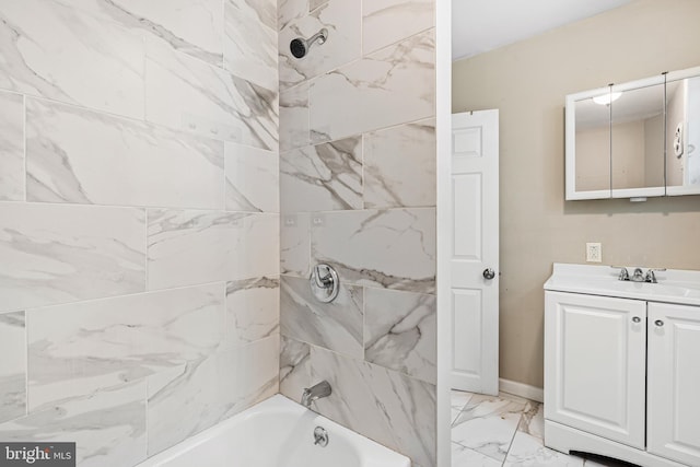 2729 W Seltzer St, Philadelphia, PA 19132 - full bathroom with marble look tile flooring, vanity, and shower / tub combination