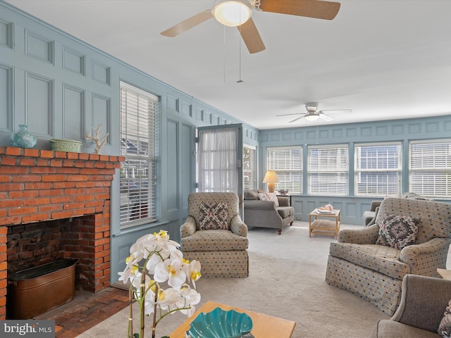 16 Delaware Ave, Rehoboth Beach, DE 19971 - carpeted living area with a decorative wall, a ceiling fan, and a fireplace