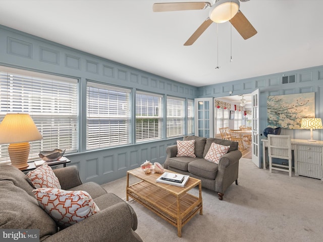 16 Delaware Ave, Rehoboth Beach, DE 19971 - living area with a decorative wall, light colored carpet, and ceiling fan