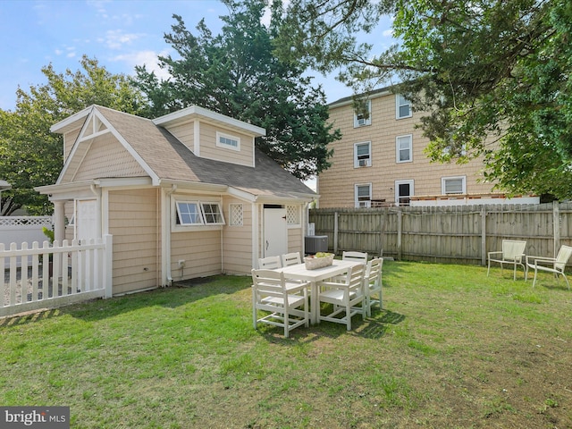 16 Delaware Ave, Rehoboth Beach, DE 19971 - rear view of house featuring an outbuilding and roof with shingles