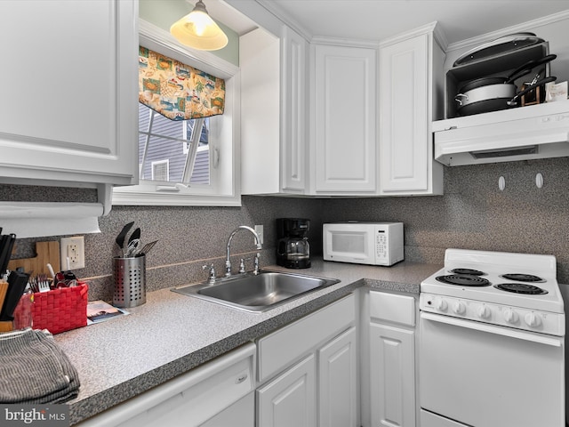 16 Delaware Ave, Rehoboth Beach, DE 19971 - kitchen with white appliances, a sink, white cabinets, and tasteful backsplash