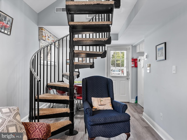 16 Delaware Ave, Rehoboth Beach, DE 19971 - staircase with wood finished floors, baseboards, and lofted ceiling