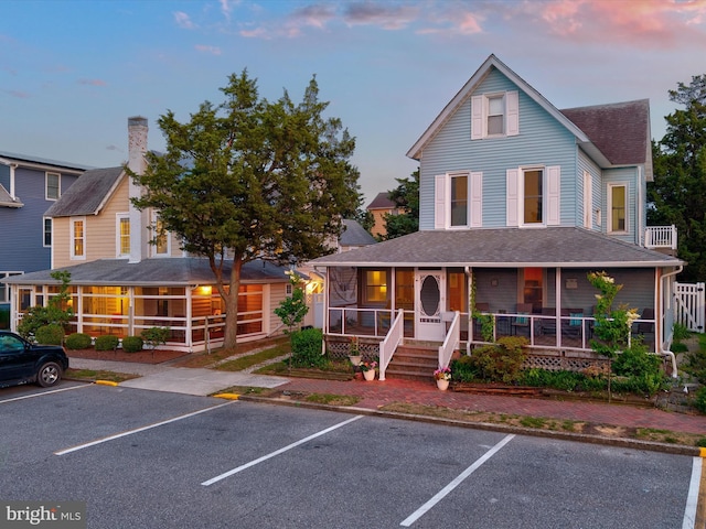 16 Delaware Ave, Rehoboth Beach, DE 19971 - farmhouse-style home featuring a porch, uncovered parking, and a shingled roof