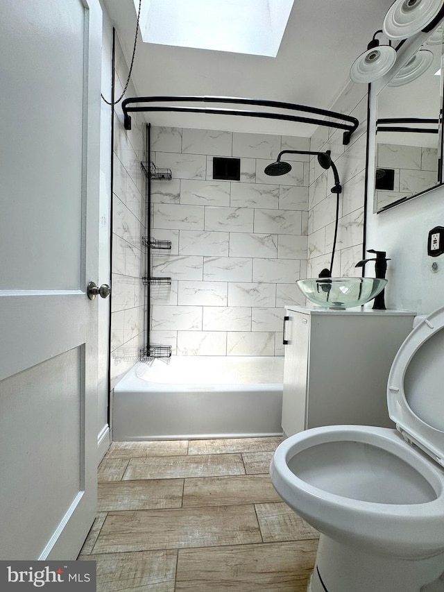 4137 Passmore St, Philadelphia, PA 19135 - full bath featuring bathtub / shower combination, vanity, a skylight, and toilet