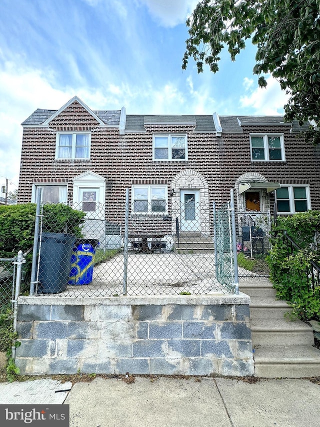 4137 Passmore St, Philadelphia, PA 19135 - multi unit property featuring a fenced front yard and brick siding