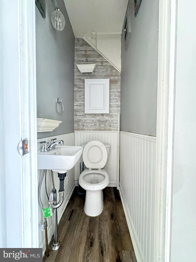4137 Passmore St, Philadelphia, PA 19135 - half bath with toilet, a wainscoted wall, and wood finished floors