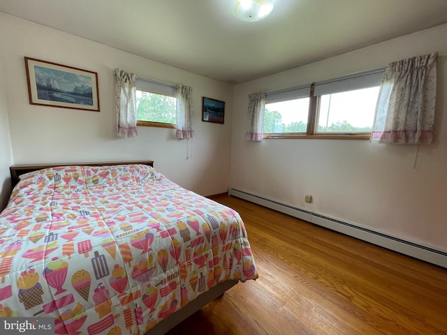 210 Potomac St, Cumberland, MD 21502 - bedroom featuring baseboard heating and wood finished floors