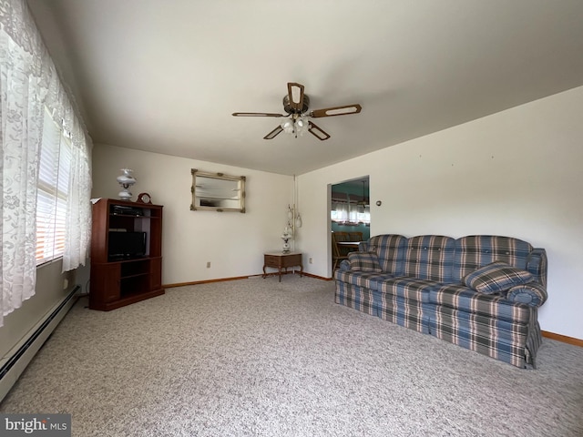 210 Potomac St, Cumberland, MD 21502 - carpeted living area with a baseboard radiator, a ceiling fan, and baseboards