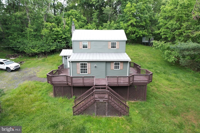 704 E F St, Brunswick, MD 21716 - rear view of house featuring stairs, a deck, metal roof, and a lawn
