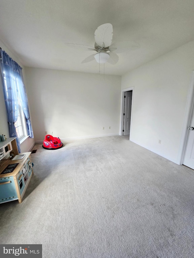 7677 Green Ridge Ln, Abbottstown, PA 17301 - unfurnished living room with carpet, ceiling fan, and baseboards