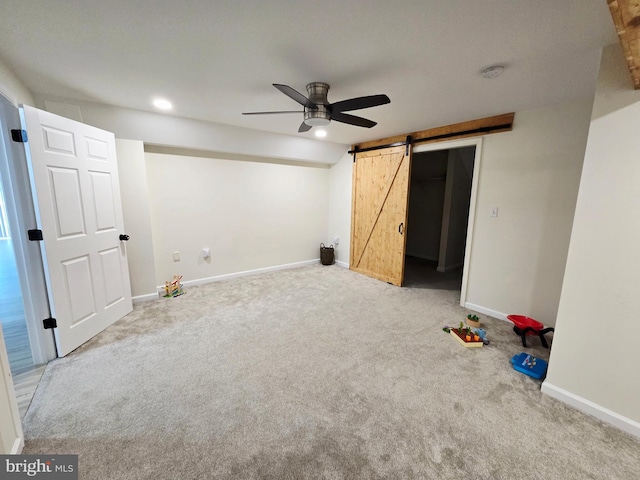 7677 Green Ridge Ln, Abbottstown, PA 17301 - unfurnished bedroom featuring a barn door, carpet floors, baseboards, and ceiling fan