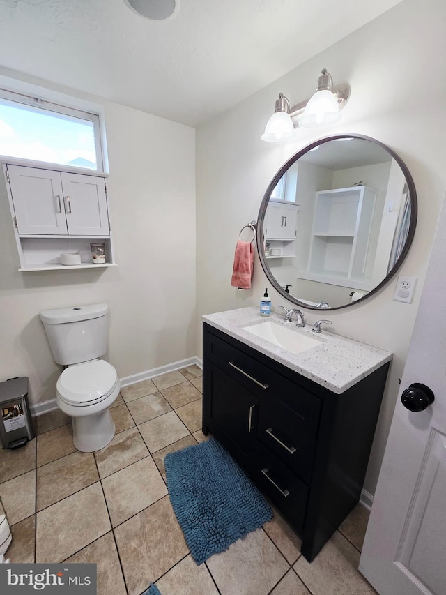 7677 Green Ridge Ln, Abbottstown, PA 17301 - bathroom with toilet, vanity, baseboards, and tile patterned floors