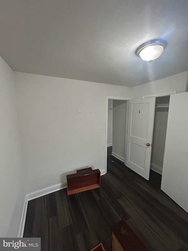 5258 Saint Charles Ave, Baltimore, MD 21215 - empty room with dark wood-type flooring and baseboards