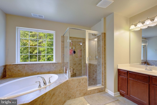 1967 Baythorne Rd, Prince Frederick, MD 20678 - full bathroom with a garden tub, vanity, a stall shower, and tile patterned flooring