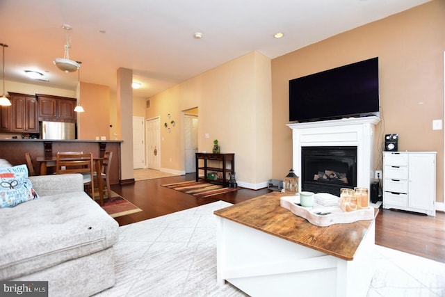 605 N Atlantic Ave Unit 204, Collingswood, NJ 08108 - living room featuring wood finished floors, a fireplace, and baseboards