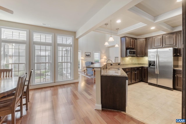 5625 Upland Dr, Crozet, VA 22932 - kitchen featuring stainless steel appliances, a peninsula, beamed ceiling, dark brown cabinets, and a sink