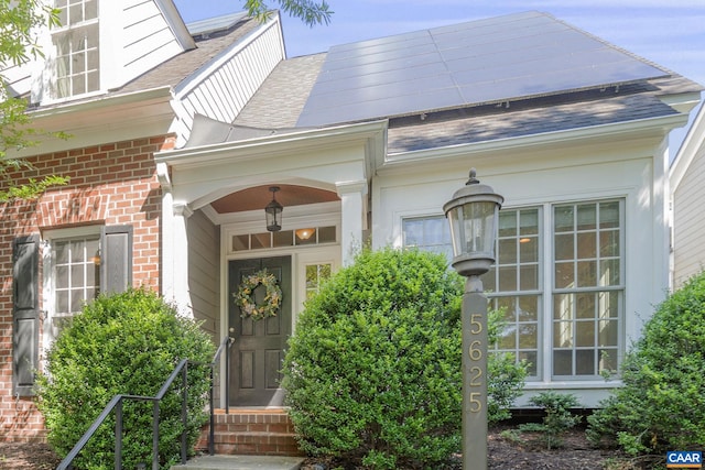 5625 Upland Dr, Crozet, VA 22932 - doorway to property featuring brick siding and roof with shingles