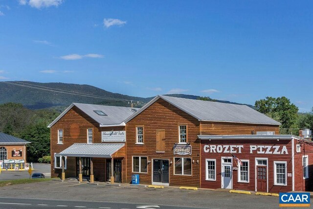 5625 Upland Dr, Crozet, VA 22932 - view of building exterior with a mountain view and uncovered parking
