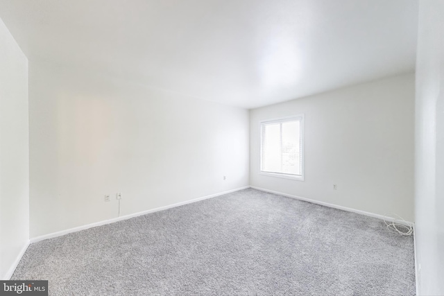 6952 Hanover Pkwy Unit 300, Greenbelt, MD 20770 - empty room featuring carpet and baseboards