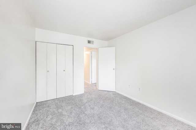6952 Hanover Pkwy Unit 300, Greenbelt, MD 20770 - unfurnished bedroom featuring carpet, baseboards, and a closet