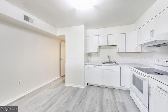 6952 Hanover Pkwy Unit 300, Greenbelt, MD 20770 - kitchen featuring white appliances, under cabinet range hood, a sink, and light wood-style floors